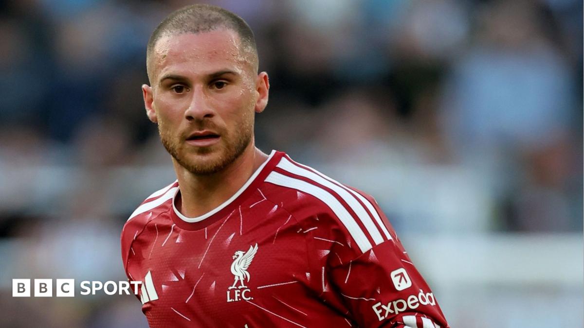 Liverpool midfielder Alexis Mac Allister, wearing the club's red home kit, looks on during a Premier League game