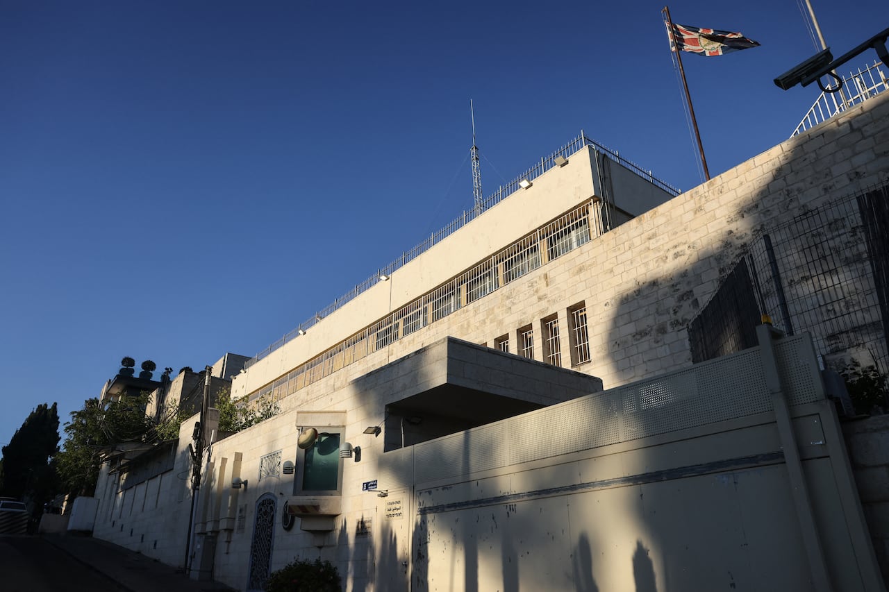 A building with an American flag flying from the roof.