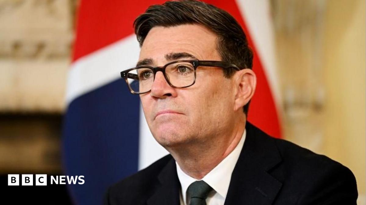Andy Burnham sitting in front of a Union Flag in Downing Street