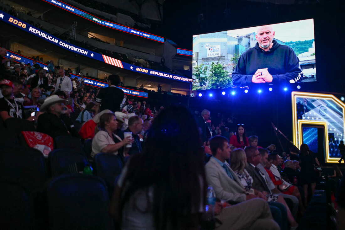 Sen. John Fetterman, D-Pa., is displayed on a screen as he delivers a video message during the Republican National Midterm Convention at the American Airlines Center in Dallas on Wednesday.