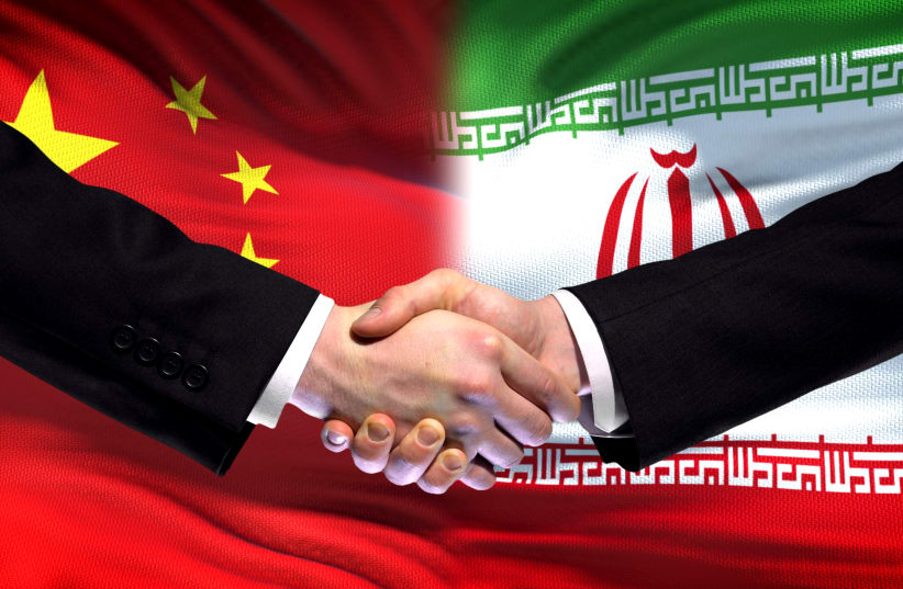 An illustration of a handshake over the backdrop of a Chinese and Iranian flag.