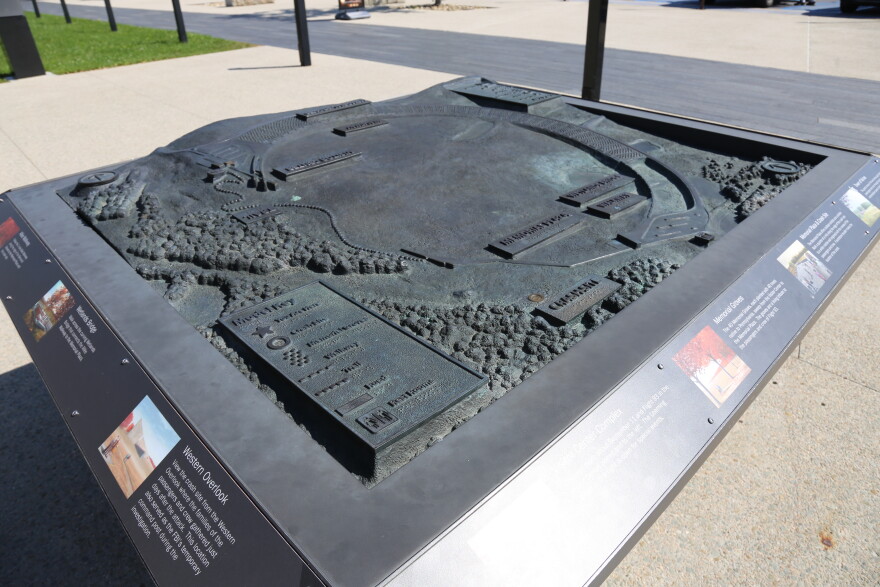 A raised-relief model of Flight 93 National Memorial displays the crash site, memorial features and surrounding landscape.