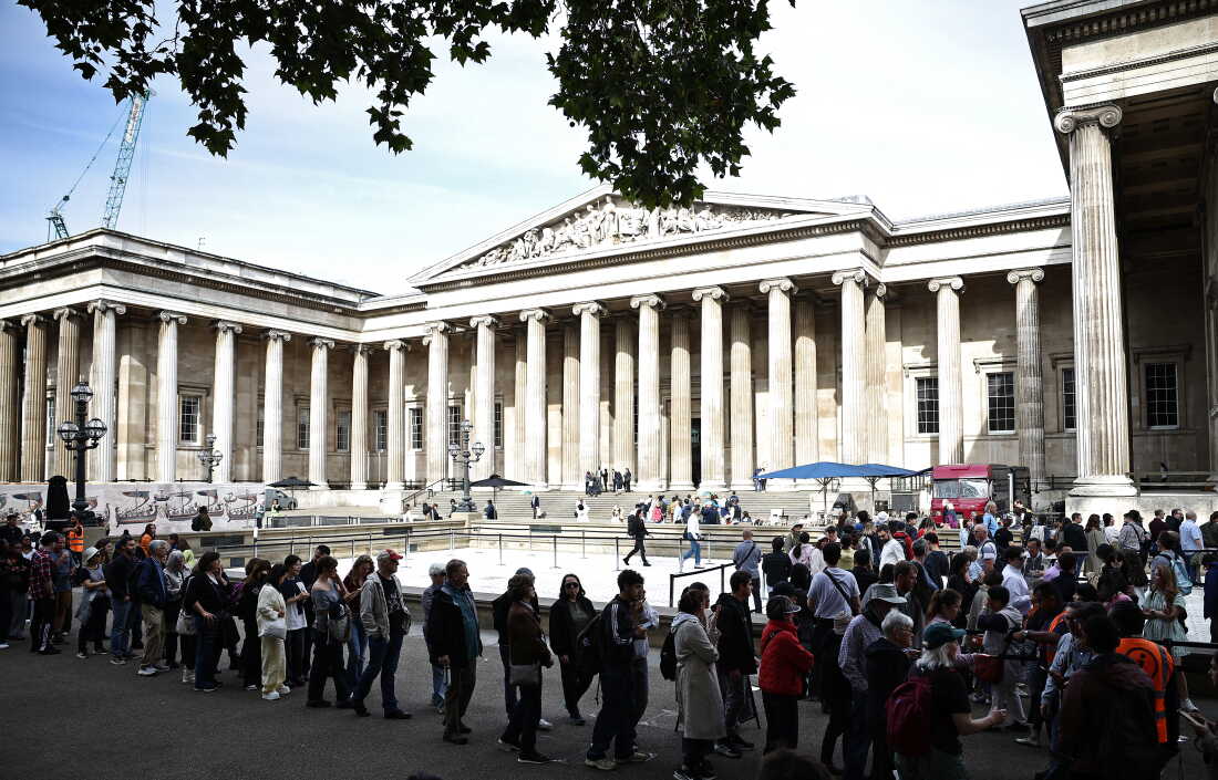 People queue to enter the British Museum in London on Thursday, the first day of the Bayeux Tapestry exhibition. London's sold-out Bayeux Tapestry exhibition opened on September 10 to a British public gripped by "mania" as the medieval artwork depicting the Norman conquest of England goes on display outside France for the first time. (Photo by Henry NICHOLLS / AFP via Getty Images)