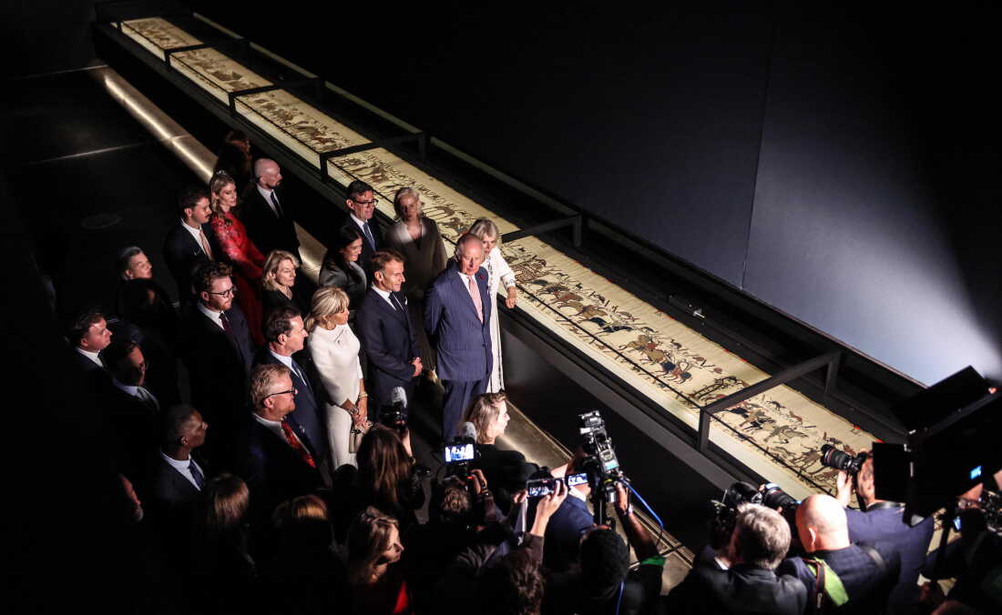 King Charles III and Queen Camilla, accompanied by France's President Emmanuel Macron and his wife Brigitte Macron, British Prime Minister Andy Burnham and his wife Marie-France van Heel, view the Bayeux Tapestry exhibition at the British Museum on Sept. 2 in London.