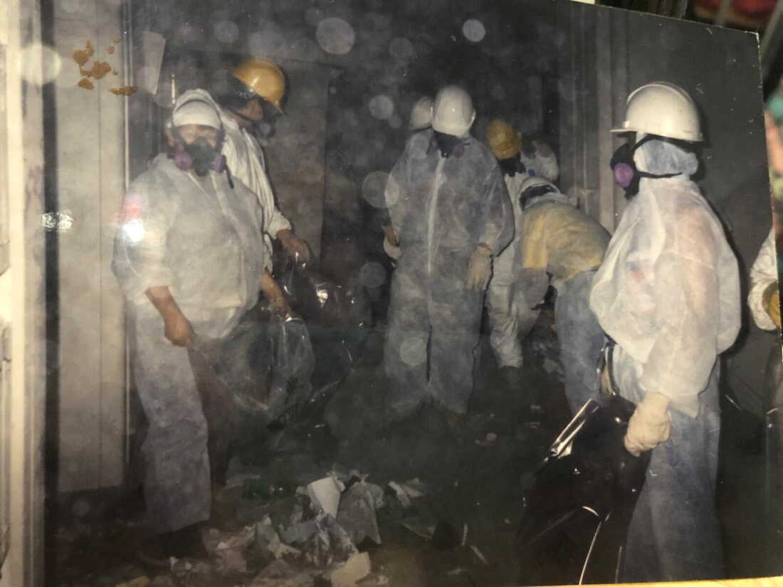 A photo provided by a member of a Sept. 11 cleanup crew support group in Queens, New York, shows a group of workers at the ground zero site in the immediate aftermath of the Sept. 11 attacks.