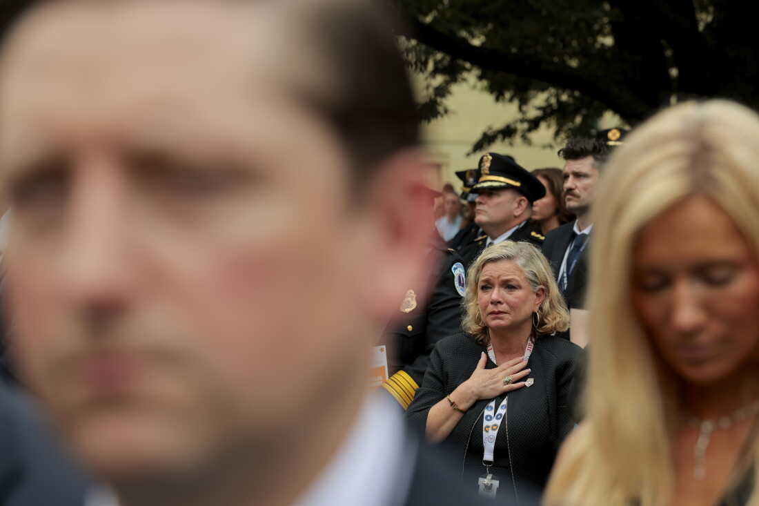 People look on during a ceremony commemorating the 25th anniversary of the September 11th terrorist attacks in the courtyard of the Pentagon on September 11, 2026 in Arlington, Va.