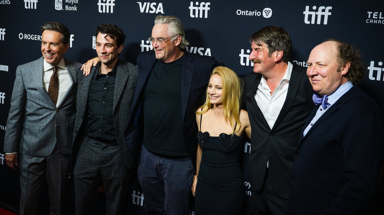 A group of people pose together.