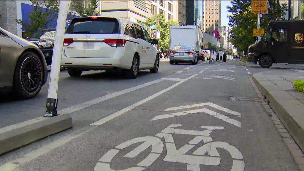 'Doug Ford, stay in your lane': Cyclists ride in opposition to plans to remove bike lanes