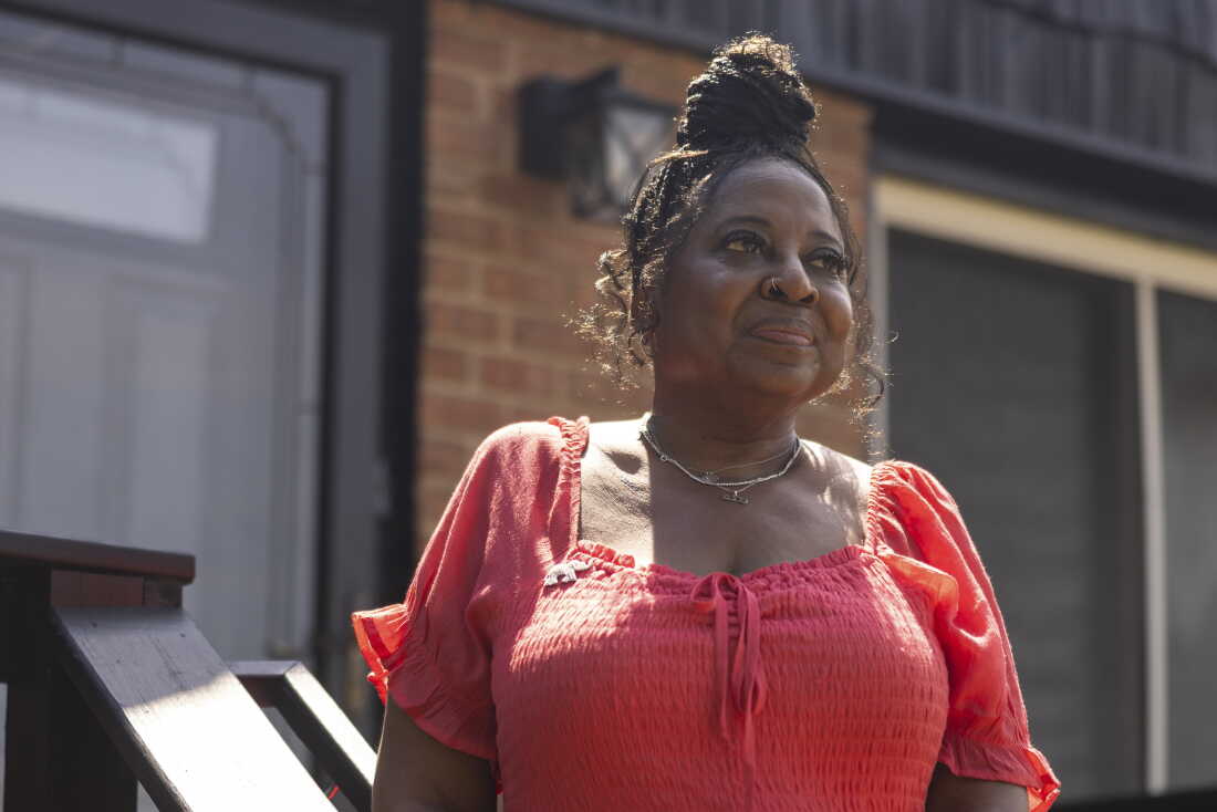 Kimberly Holmes-Ross stands outside her family home in Evanston, Illinois.