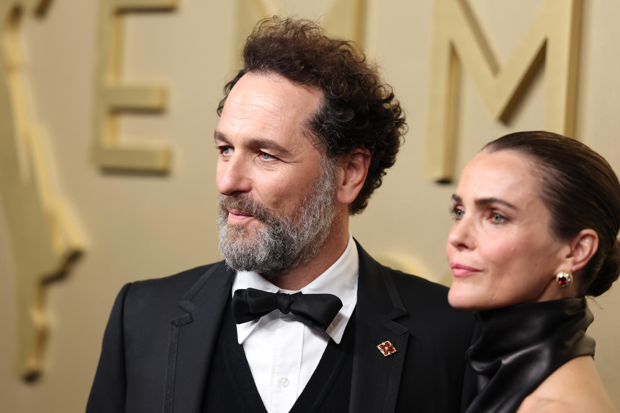 Matthew Rhys and Keri Russell pose on the Emmys blue carpet. 