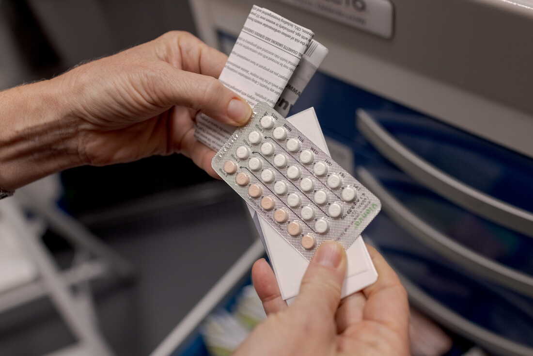 A nurse displays a set of birth control pills at Pima County Health Department's Northwest Clinic, which offers free reproductive health services for all ages through federal funding from Title X, in Tucson, Arizona, on Thursday, September 3, 2026.
