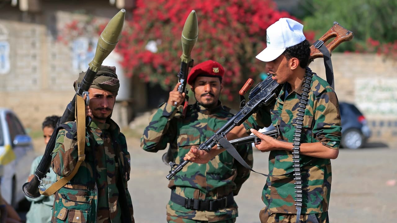 Fighters loyal to the Houthi authorities, brandish their weapons during a rally to recruit more fighters, in Sanaa on September 10, 2026.