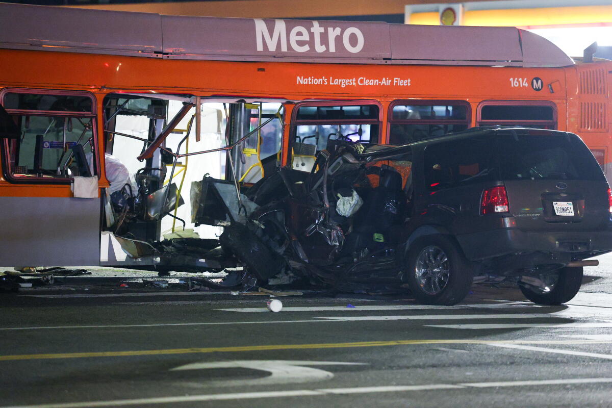The scene of a crash with an SUV embedded in a Metro bus