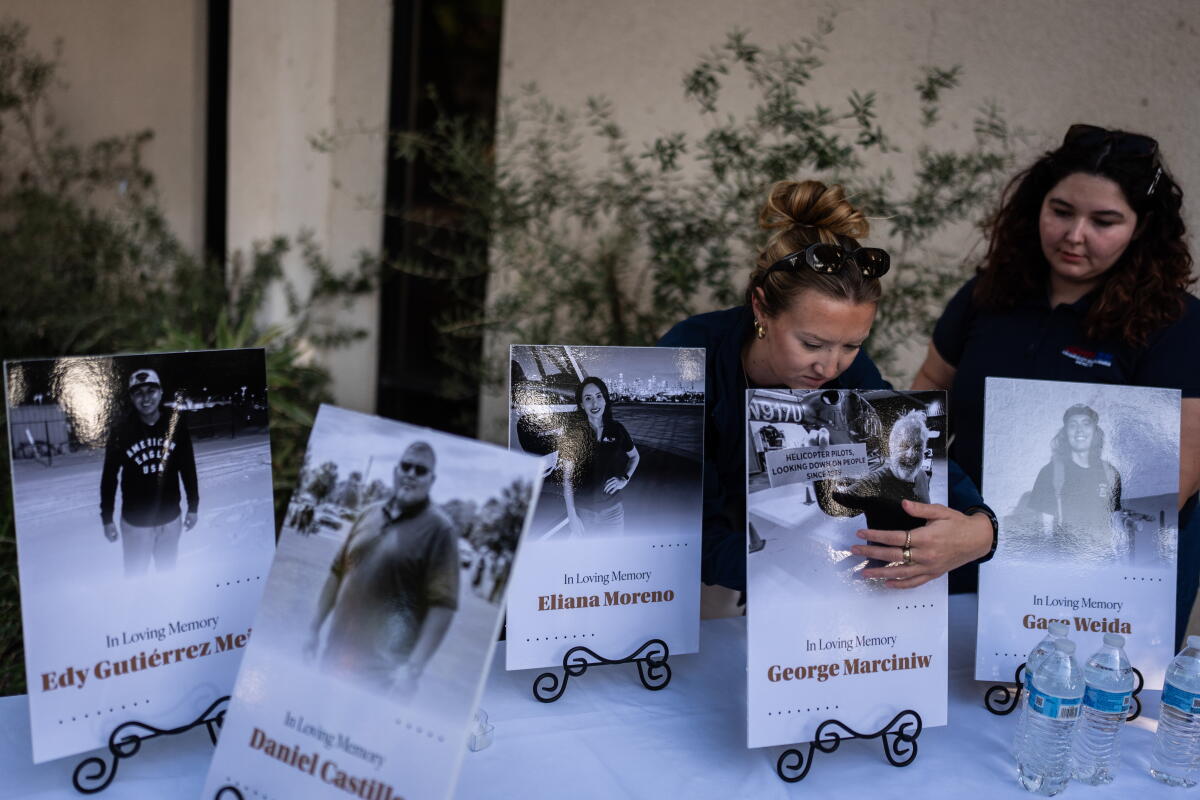 two women help set up a vigil