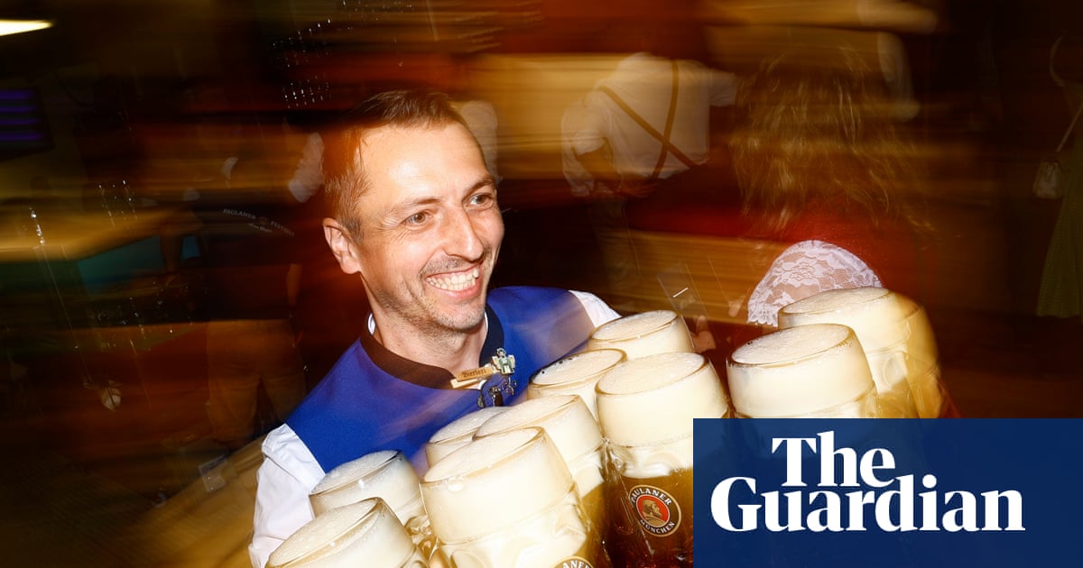 Lederhosen, sauerkraut and tapping the first barrel: Oktoberfest 2026 opens – in pictures - The Guardian