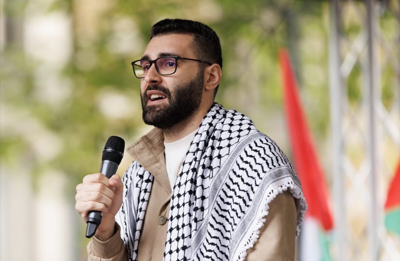 Palestinian photojournalist Motaz Azaiza speaks to the crowd at the end of the 14th national march for Palestine on May 18, 2024 in London, England.