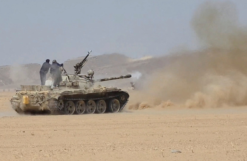 Members of the Saudi-backed Yemeni government forces fire a tank during what they say to be clashes with Yemen's Iran-aligned Houthis in a location given as near Al-Hazm, Yemen, in this screen grab obtained from a handout video released September 9, 2026.