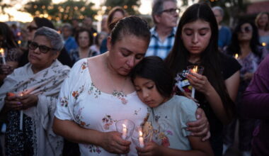Judith Cabrera and her daughter, April, attend a vigil for the victims of a fatal SUV-Metro bus collision and the subsequent crash of a TV news helicopter covering it in the Chatsworth neighborhood of Los Angeles, Thursday, Sept. 17, 2026. (AP Photo/Jae C. Hong)