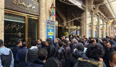 Crowds gather outside a currency exchange office in Tehran amid economic uncertainty and currency devaluation
