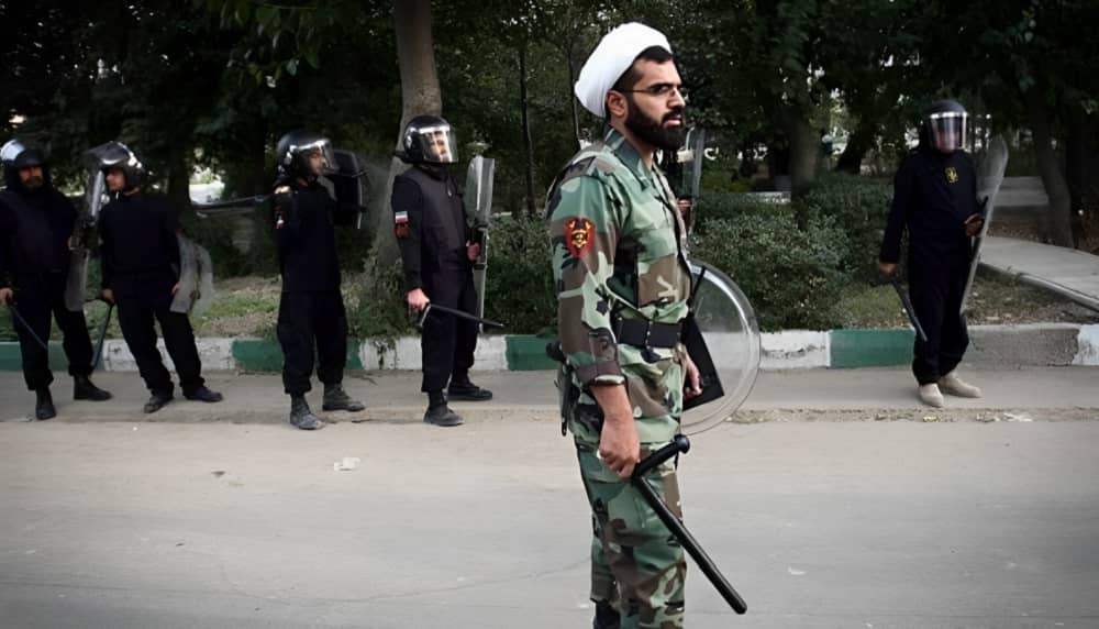 Iranian state-affiliated cleric wearing military gear and uniform during deployment to crack down on protesters
