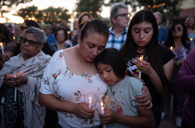 Judith Cabrera and her daughter, April, attend a vigil for the victims of a fatal SUV-Metro bus collision and the subsequent crash of a TV news helicopter covering it in the Chatsworth neighborhood of Los Angeles, Thursday, Sept. 17, 2026. (AP Photo/Jae C. Hong)