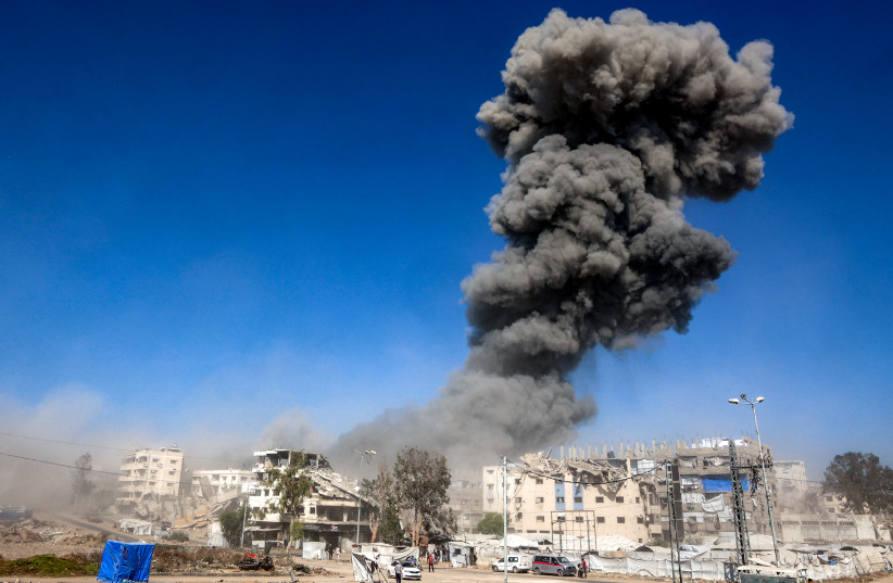 A smoke plume billows during an Israeli strike on an industrial area in Gaza City on July 12, 2026; Illustrative.
