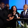 Christine Wells-Wonsley (center) is flanked by her husband, Elmore (second from left), attorney Ben Crump (left), and the Rev, Al Sharpton (right) during a memorial service on Monday in Ocean Springs, Miss., for her son Nolan Xavier Wells, an 18-year-old found dead after taking a July 4 boat trip with friends.