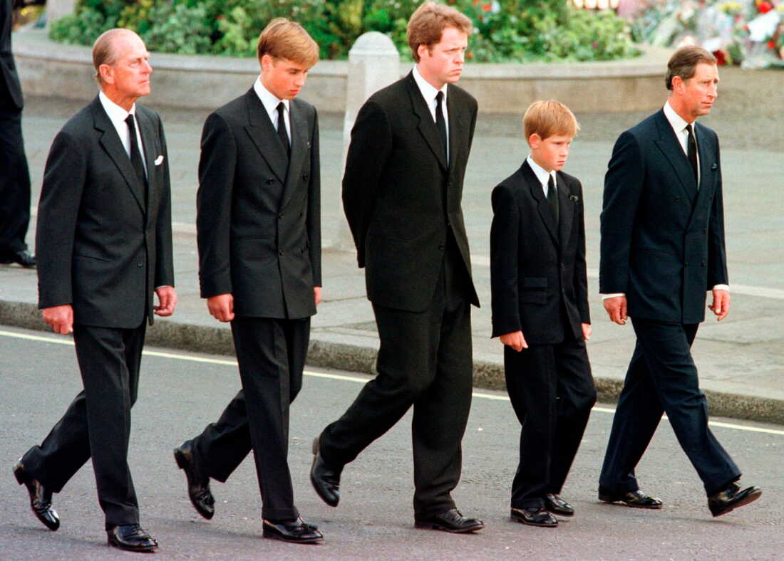 FILE - From left: Britain's Prince Philip, Prince William, Earl Spencer, Prince Harry and Prince Charles walk outside Westminster Abbey during the funeral procession for Diana, Princess of Wales, Sept. 6, 1997.