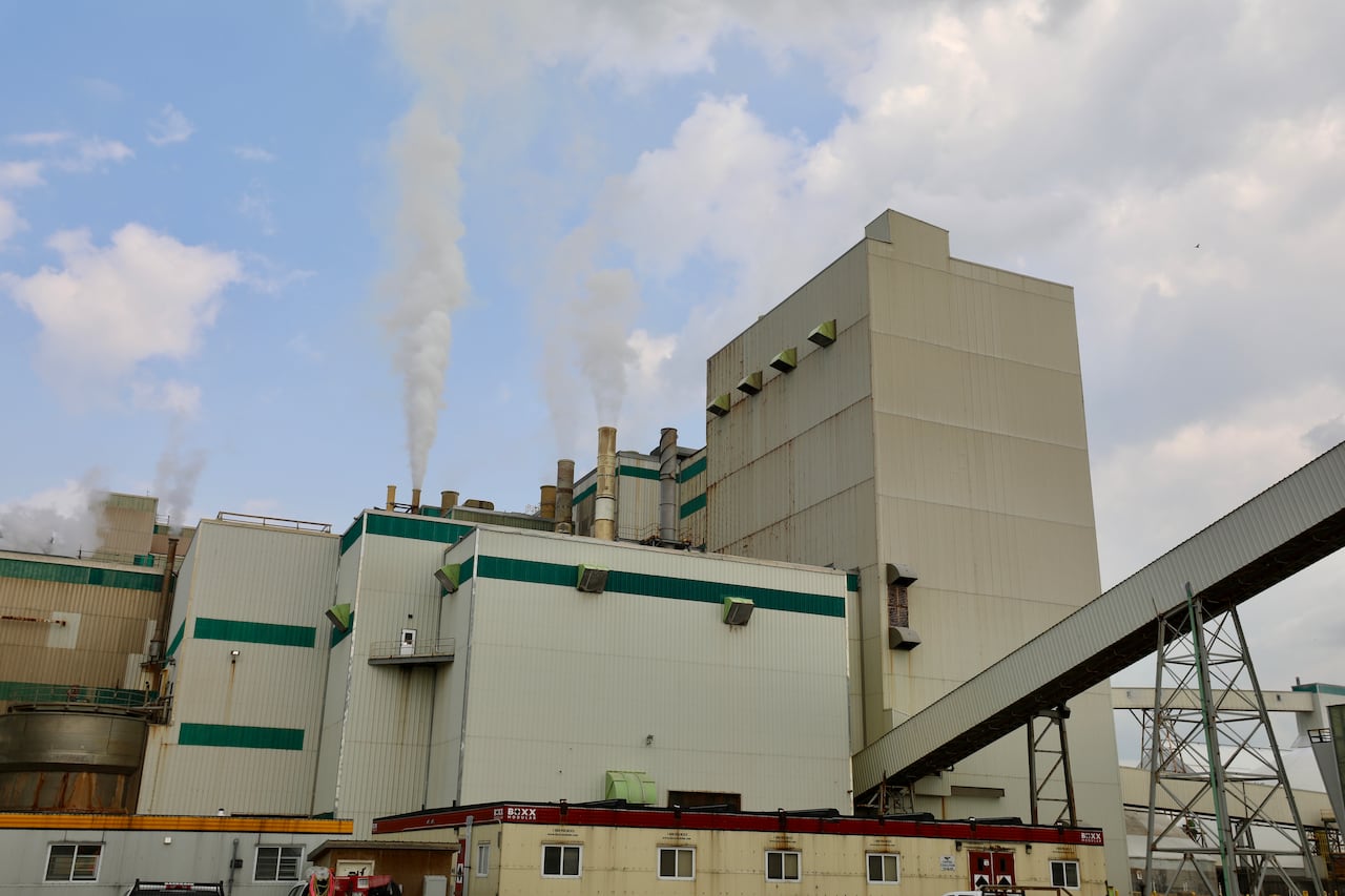 Smoke is shown rising from a metal structure.