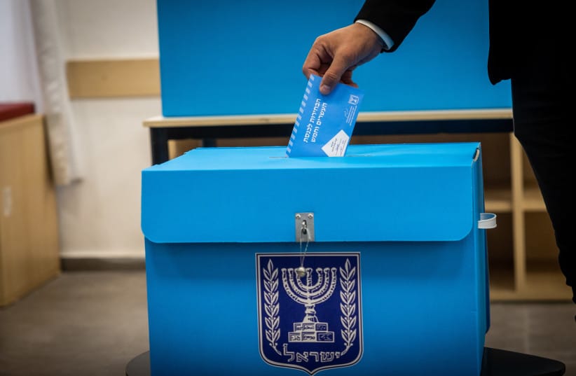 A man casts his vote in the Israeli general elections, at a polling station in Jerusalem, on November 1, 2022.