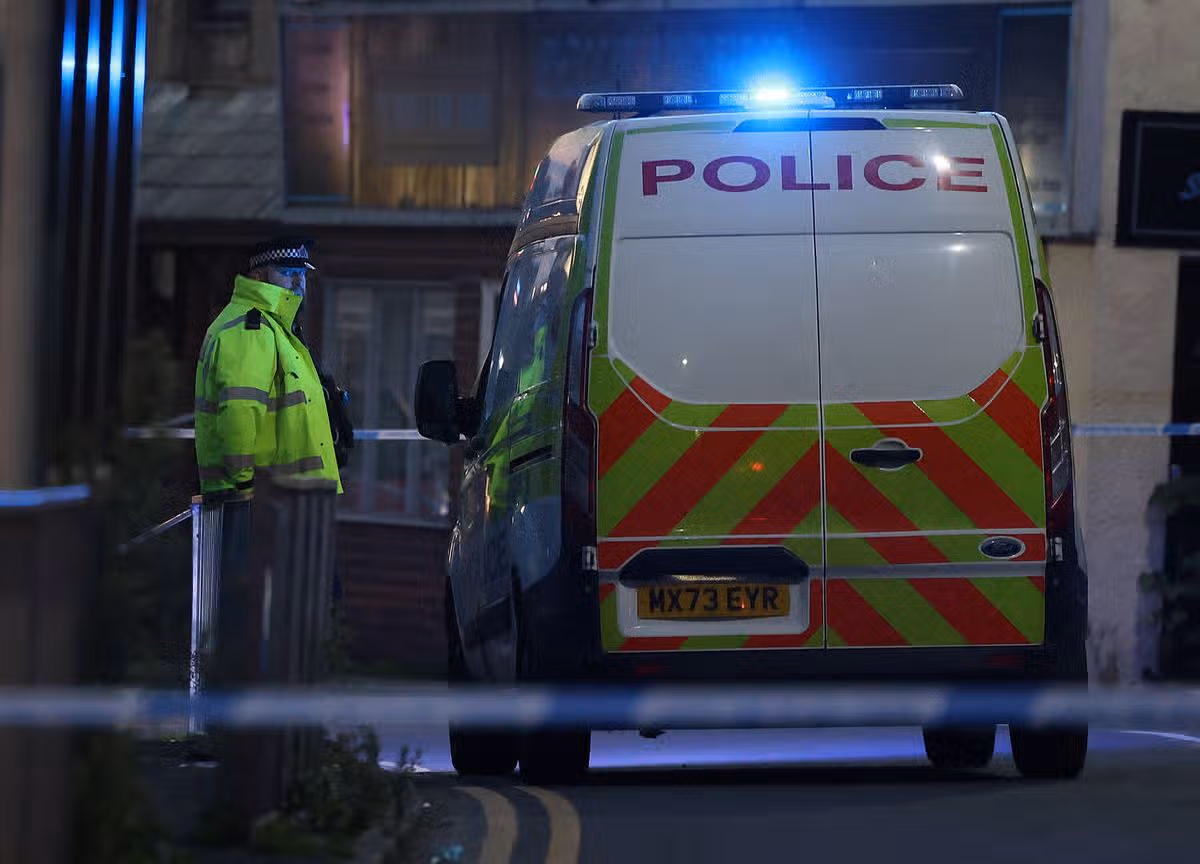 Police at the scene on Whittaker Lane, Prestwich