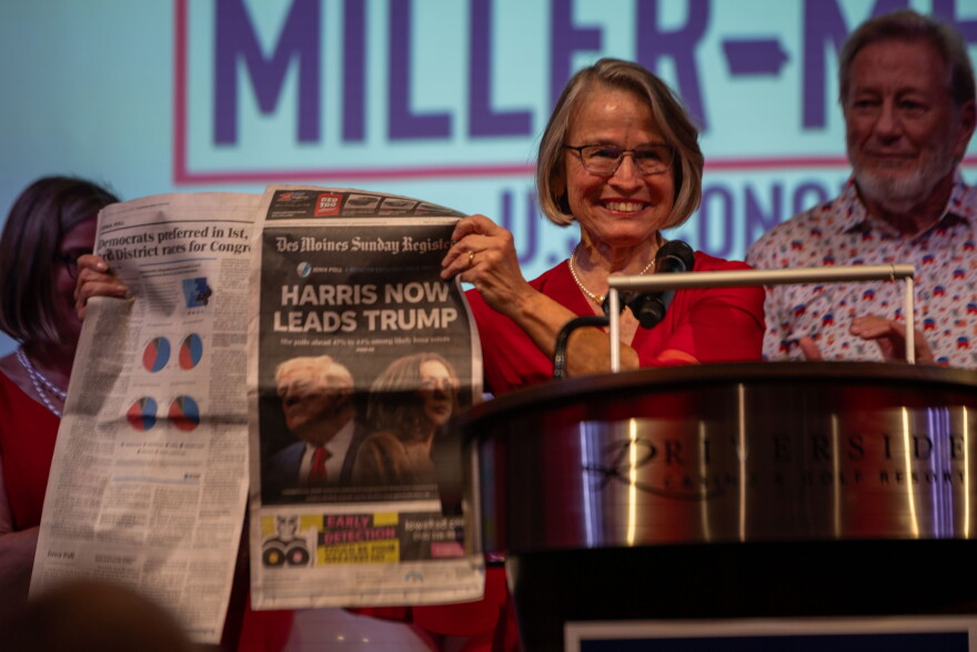 Republican Rep. Mariannette Miller-Meeks holds up the Des Moines Register at her election night watch party criticizing a poll published three days before that inaccurately predicted Democrat Kamala Harris would win Iowa.
