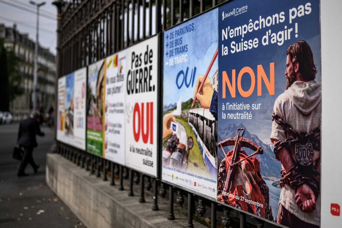 A campaign poster urges Swiss voters to reject a neutrality initiative ahead of a Sept. 27 nationwide vote on whether to enshrine permanent armed neutrality in the constitution and limit participation in military alliances and sanctions.