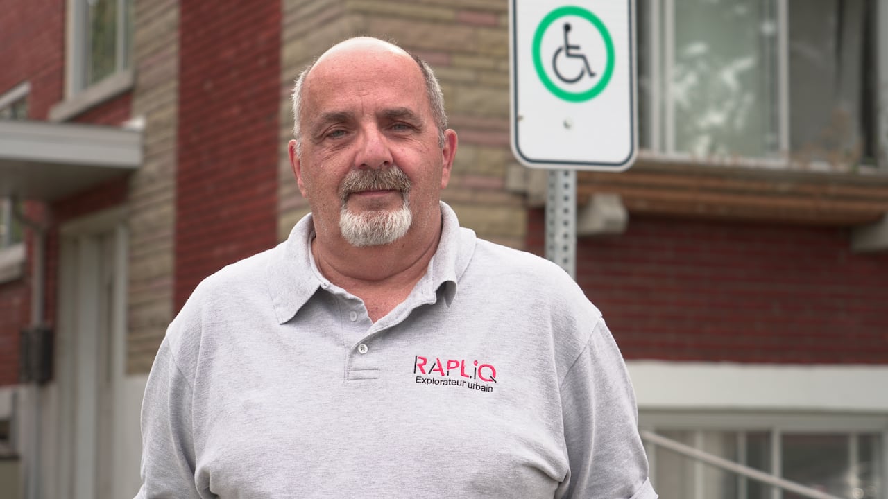 Man from advocacy group RAPLIQ in front of his house