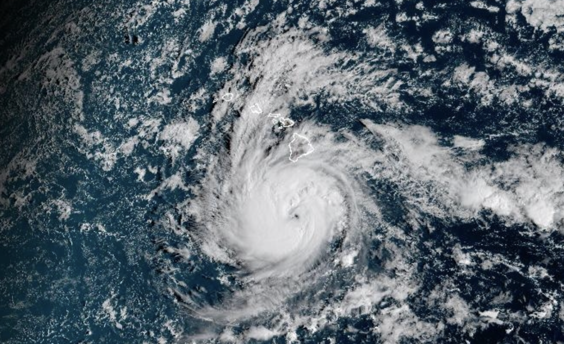 Hurricane Nolo is seen approaching Hawaii's islands, in this satellite image captured Friday. Nolo is expected to avoid making landfall as it strengthens, but forecasters warn it will bring dangerous flooding rains.