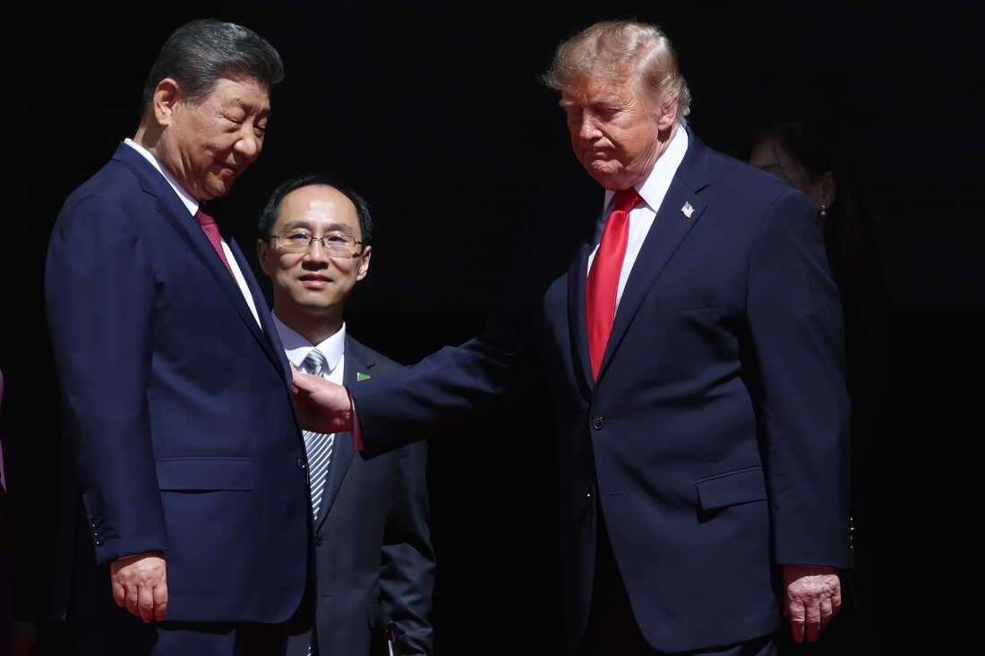 President Trump and Chinese President Xi Jinping (left) speak via an interpreter as they depart following a tour of the National Archives Museum in Washington, D.C., on September 25.