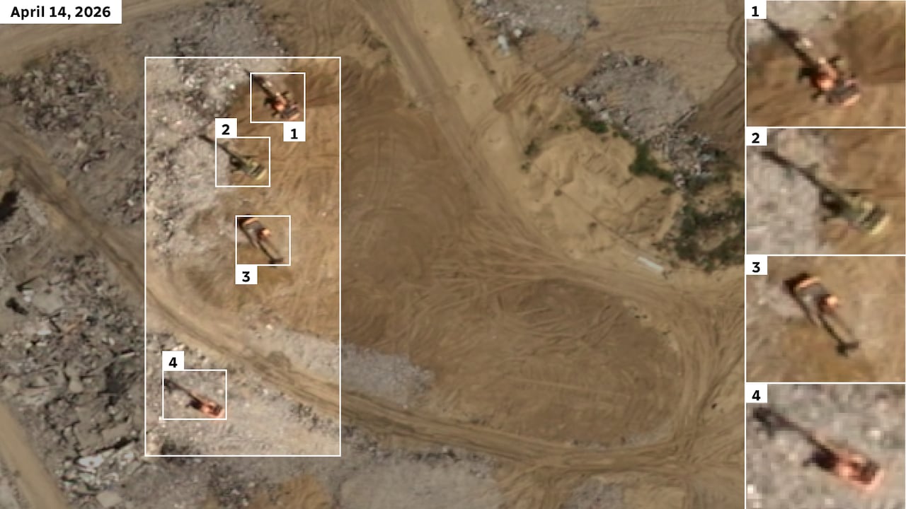 Satellite imagery showing excavators amid rubble.