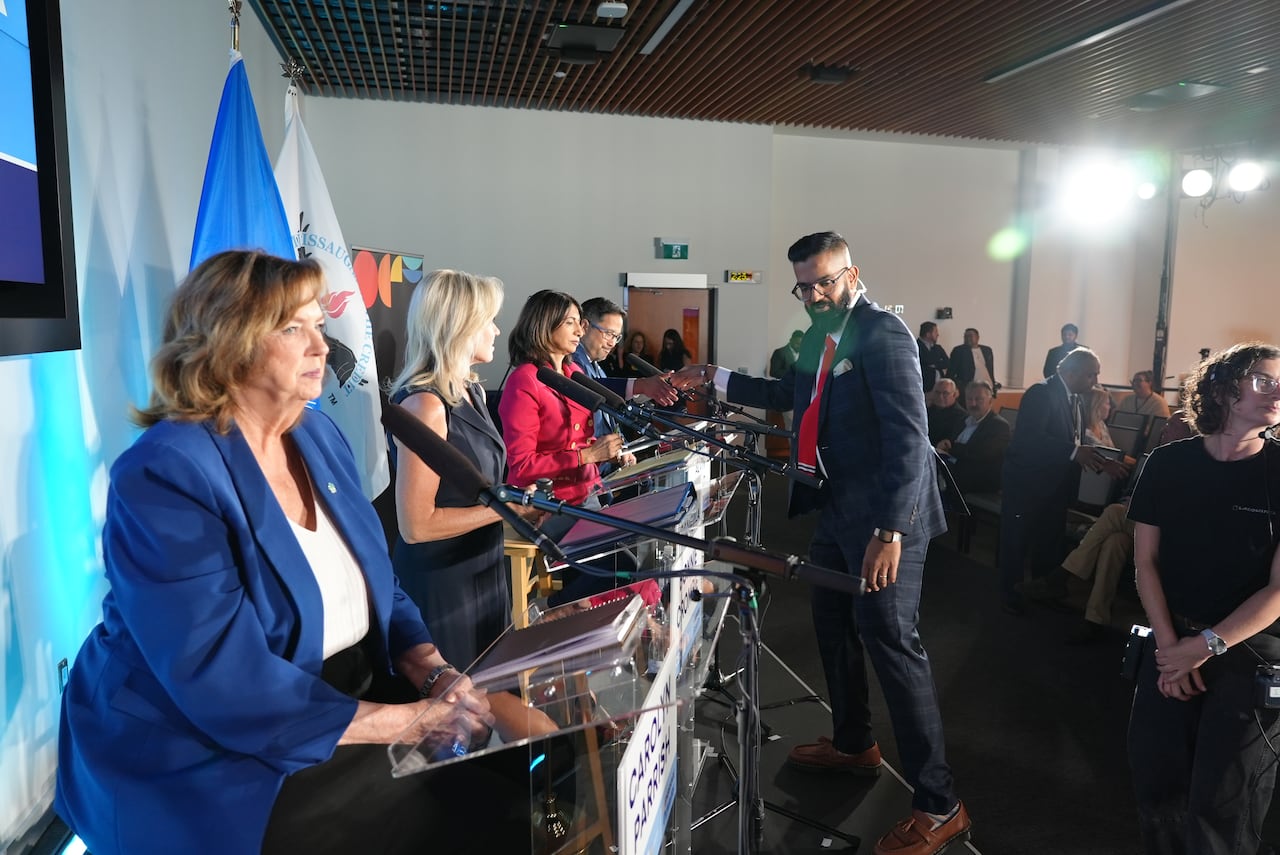 Nav Nanwa greets mayoral candidates.