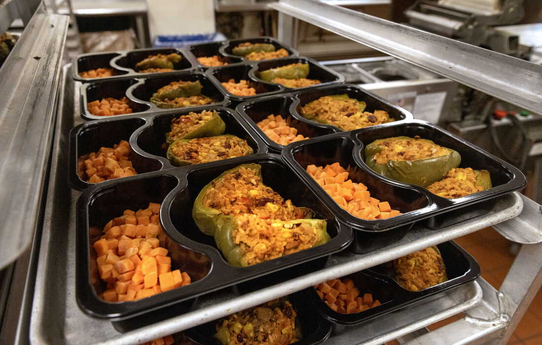 Trays of stuffed peppers and carrots from Community Servings are ready to be sealed and delivered to Boston-area residents who receive medically tailored meals.