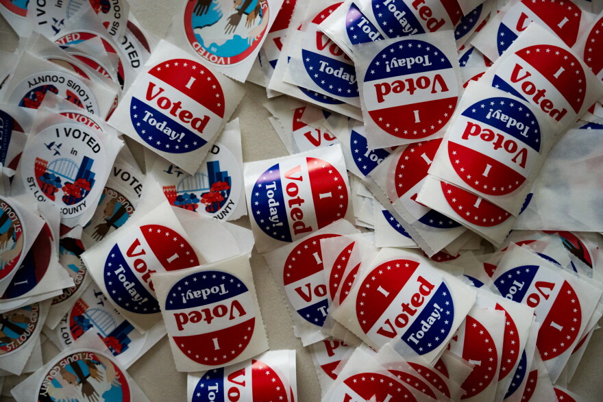 St. Louis County voting stickers are laid out for voters during the General Election on Tuesday, Nov. 5, 2024, at Holy Name Community Center in Bellefontaine Neighbors, Mo.