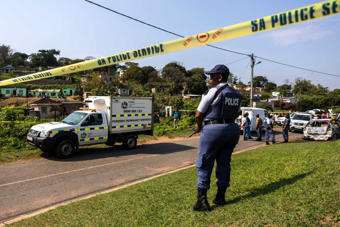 A police officer is seen at a scene of a mass shooting at a house party in KwaMakhutha township south of the city Durban, South Africa, Wednesday, Sept. 23, 2026.