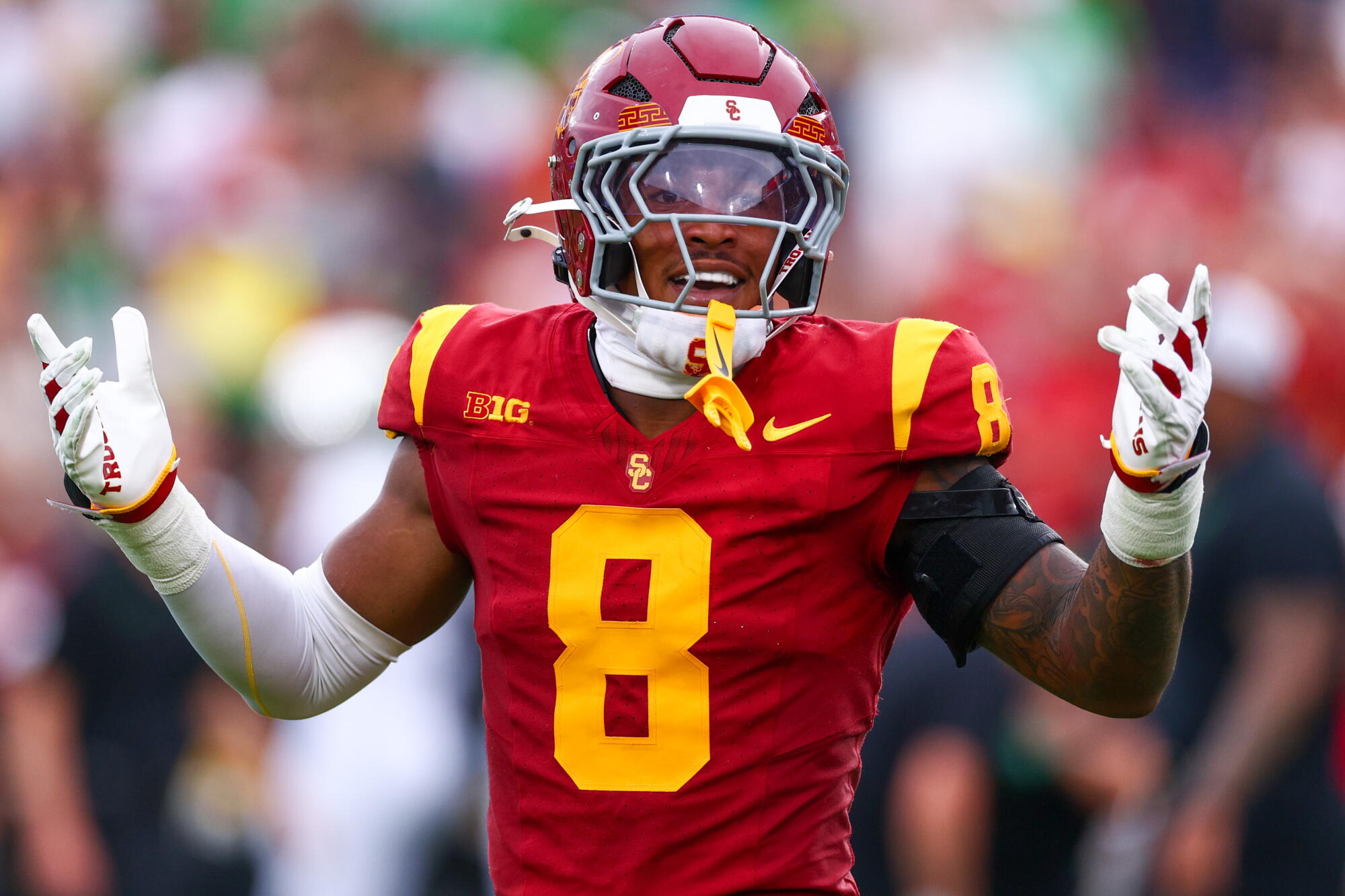 USC linebacker Desman Stephens II shrugs and smiles after making a late tackle on Oregon quarterback Dante Moore.