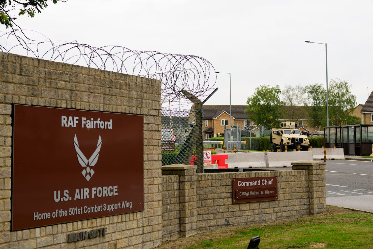 A stone fence with a sign that reads RAF Fairford.