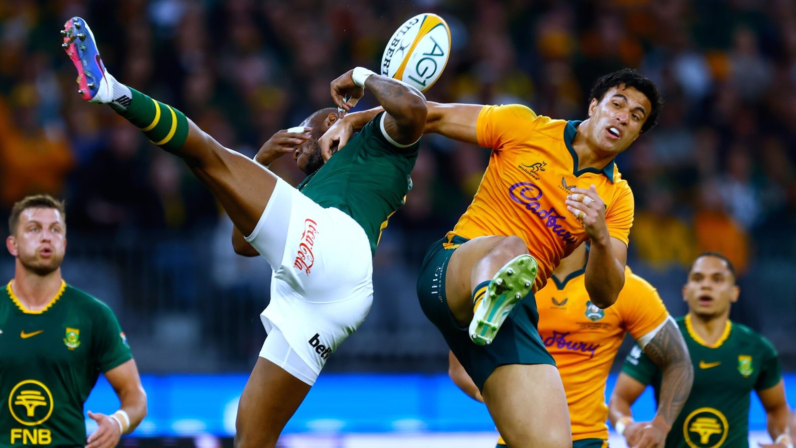 South Africa's Aphelele Fassi, left, and Australia's Joseph-Aukuso Suaalii compete for a high ball (AP Photo/Gary Day)