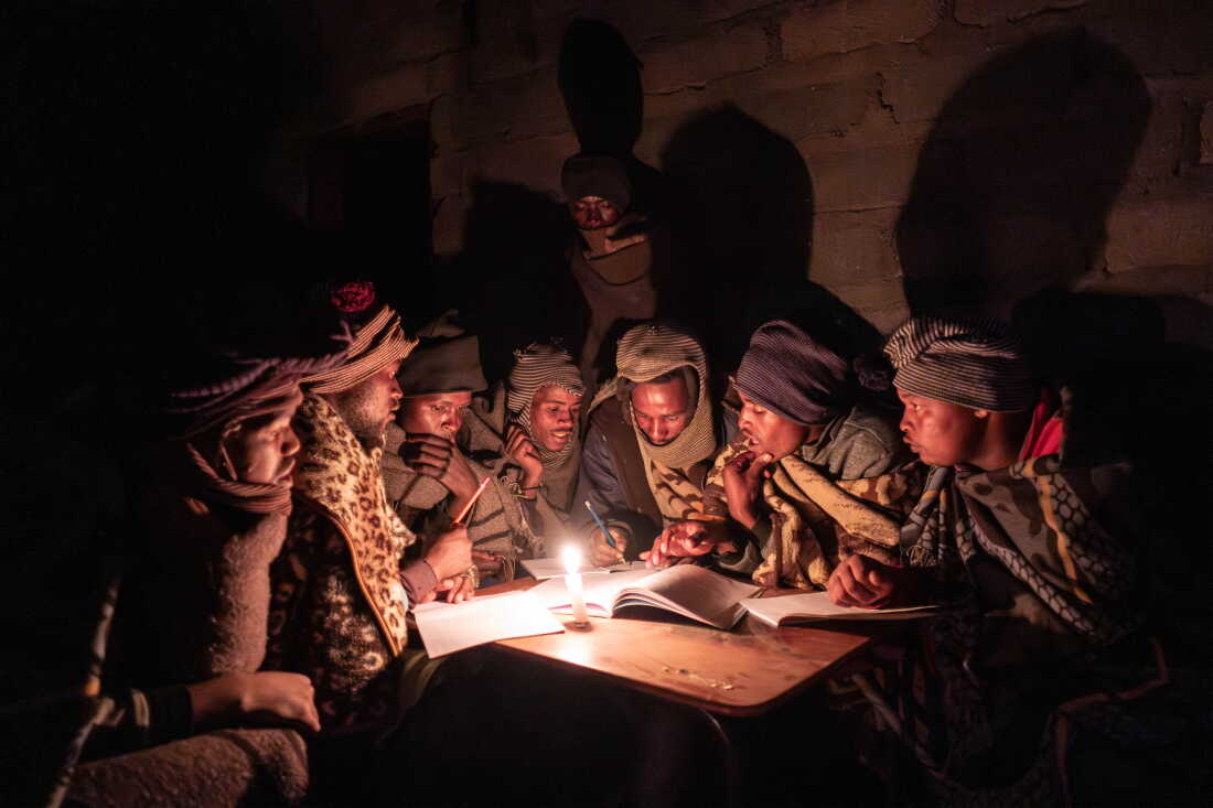 Shepherds attend a part time night school near Mokhotlong, Lesotho. For many, these classes, which occur roughly twice a month, are the only form of education they can access.