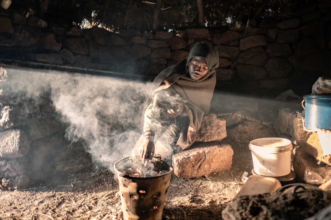 Khotso Rants'etile, 22, who has been working as a herder since the age of nine, prepares breakfast in his isolated cattle post in the mountains of Mokhotlong District, Lesotho.