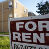 A "For Rent" sign displays outside an apartment building in Skokie, Ill., in 2024. Researchers from the Urban Institute found that a growing number of renters in the U.S. are struggling to pay for housing each month.