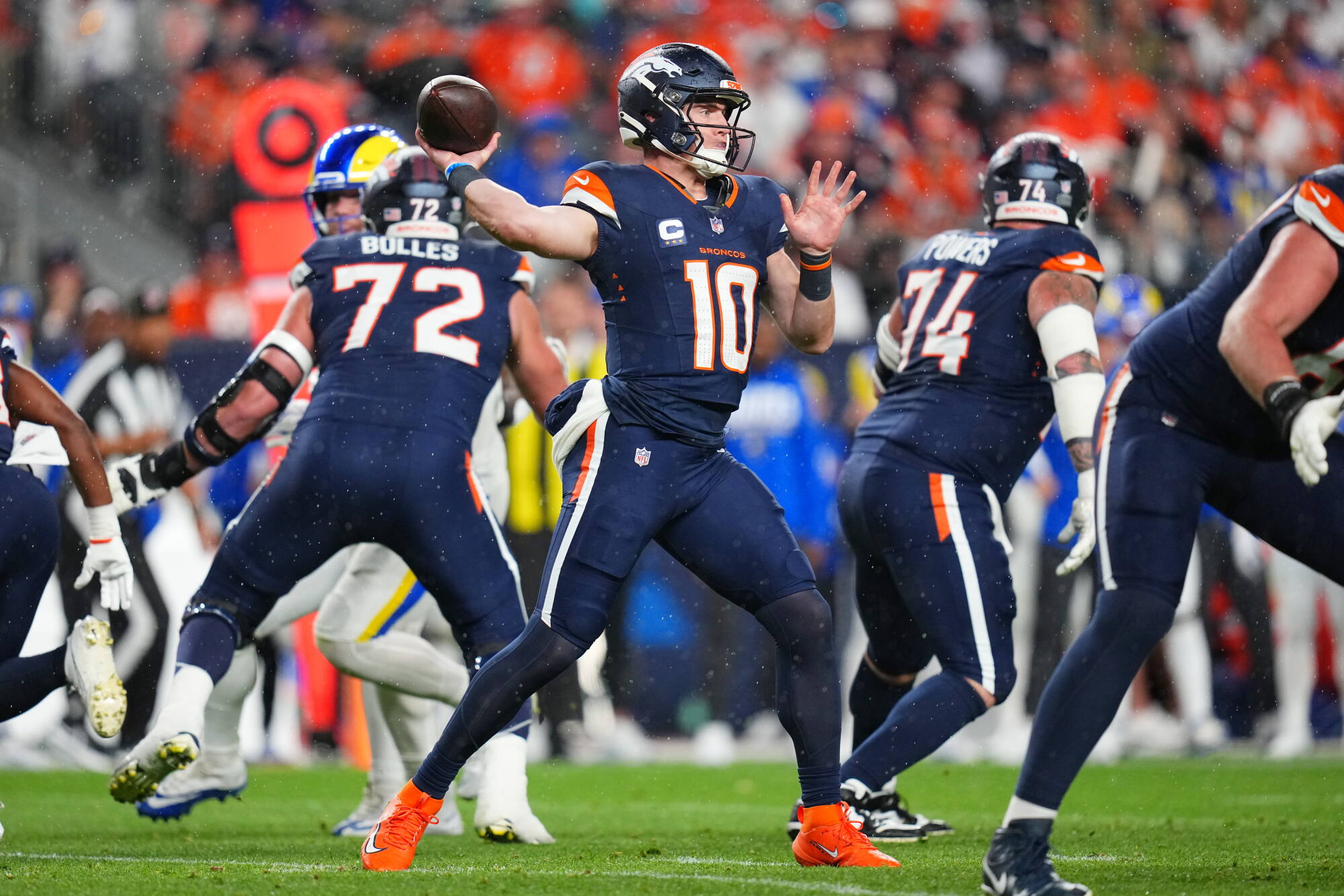 Denver Broncos quarterback Bo Nix passes against the Rams in the first half Sunday.