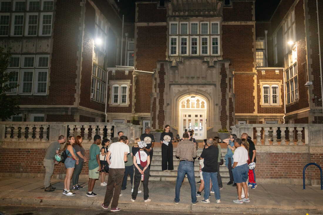 A group gathers for a rat walk in front of the Bruce-Monroe Elementary School in the Park View neighborhood of Washington D.C..