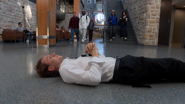 Why this Sask. university student lies down on the floor in public